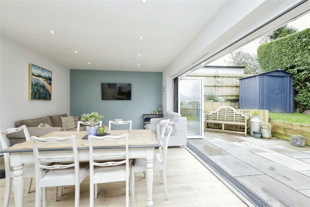 Robins Nest, Broad Oak: living space with glazed doors open to the garden, by Bramall Homes