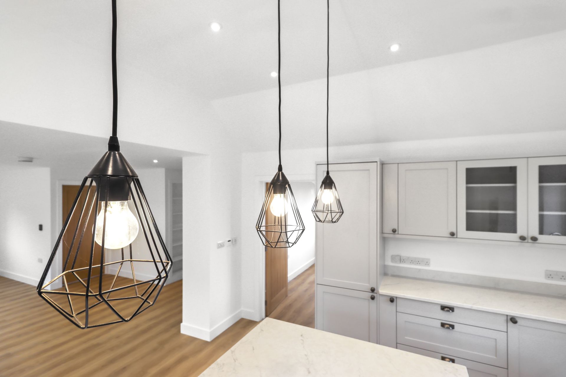 Bramley Barn, Burwash: kitchen pendant lighting detail, by Bramall Homes