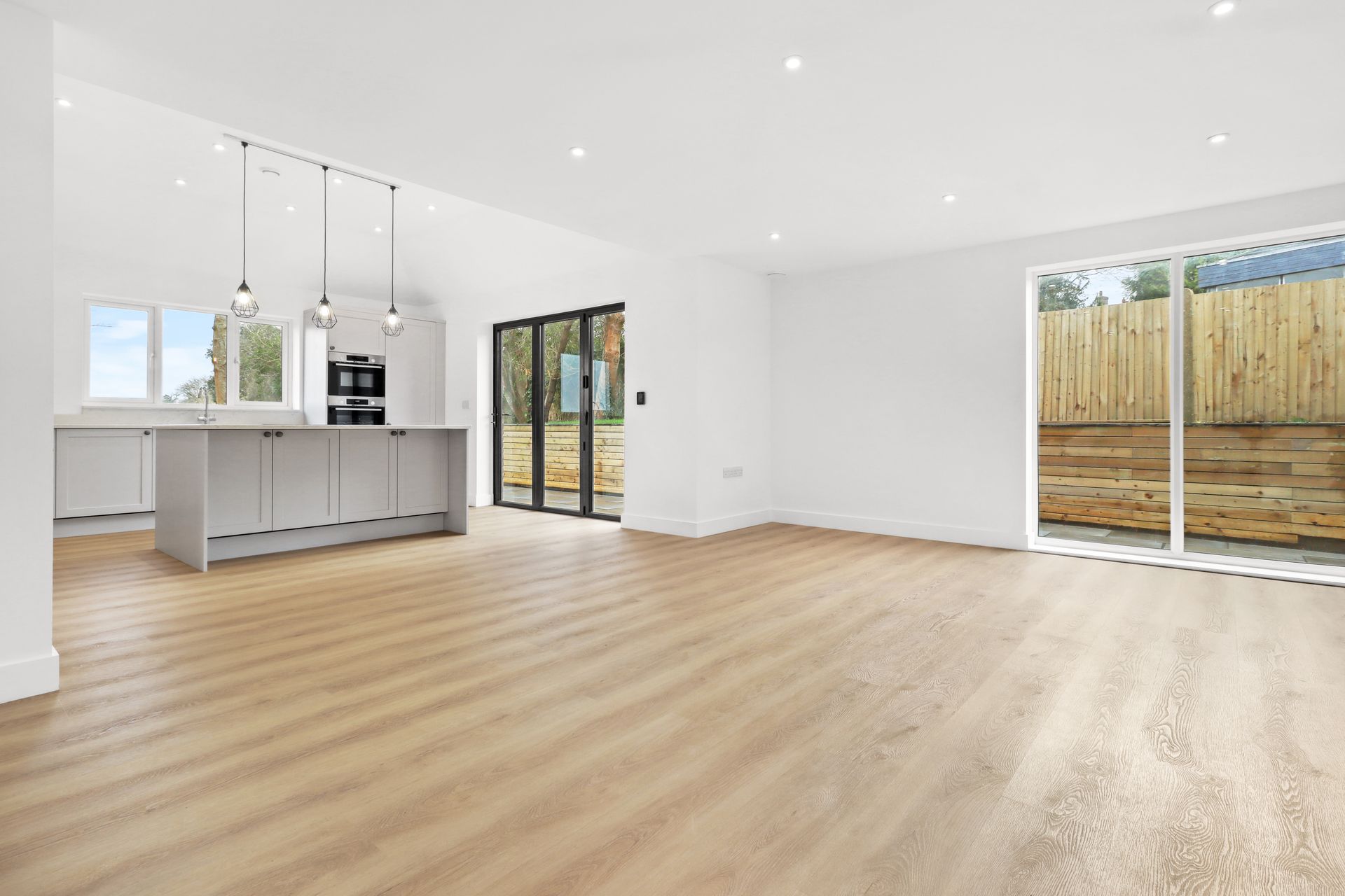 Bramley Barn, Burwash: open plan kitchen and living space, by Bramall Homes